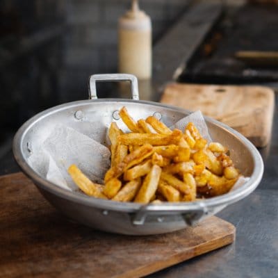 Hand-cut Belgian fries, double fried until crispy and golden, served fresh at The Limited Burger