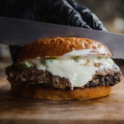 Smash burger with juicy beef patty and creamy housemade sauce on a toasted brioche bun